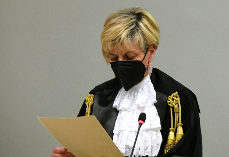 Italian Judge Marina Finiti reads the court decision during the trial of two US citizens charged with the July 2019 murder of Carabinieri officer Mario Cerciello Rega in Rome