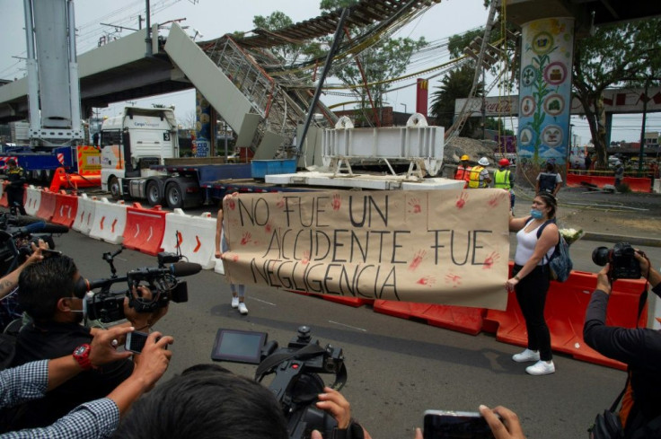 'It was not an accident, it was negligence' reads the sign at the site of metro line crash in Mexico City