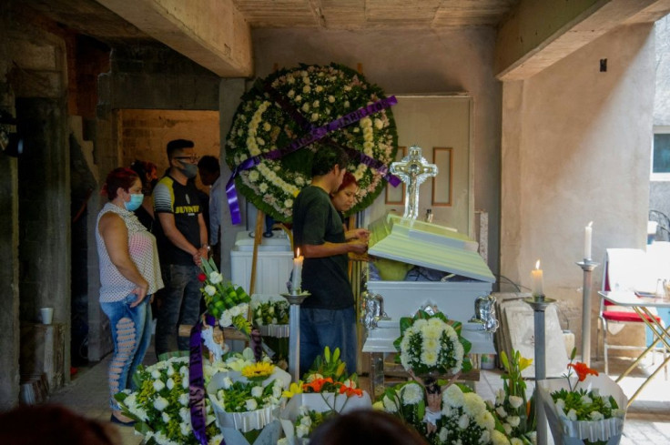 People attend the wake of 12-year-old Brandon Giovanny Hernandez Tapia who died in the metro disaster
