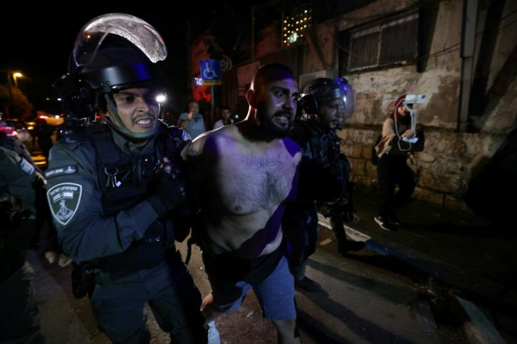 A Palestinian protester is arrested by Israeli police in the Sheikh Jarrah neighbourhood of annexed east Jerusalem, where land disputes with Jewish settlers have fuelled hostility for years