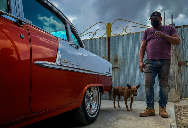 Self-taught Cuban auto body mechanic Pablo Manso repairs Chevrolets from 1955, 1956 and 1957