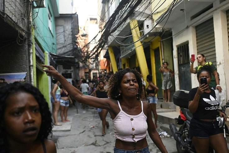 Residents of the Jacarezinho favela in Rio de Janeiro protest after a police operation against alleged drug traffickers, with questions raised about the timing and justification for the raid