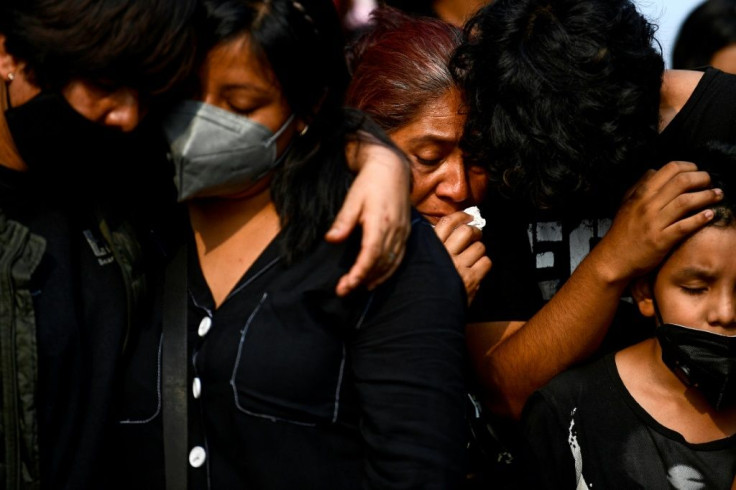 Relatives mourn Juan Luis Diaz, one of the 25 victims of Mexico City's metro disaster