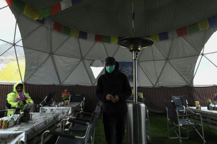 More than a thousand people are typically camped at the bustling tent city at the foot of Everest, including foreign climbers and the teams of Nepali guides that escort them to the peak