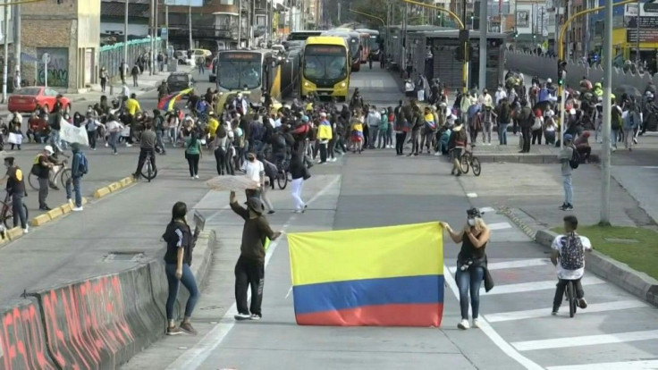IMAGESProtesters block the Avenida Caracas, an arterial road of the Colombian capital Bogota. The country's government has invited protest leaders to a dialogue in an attempt to calm tensions following more than a week of demonstrations against President