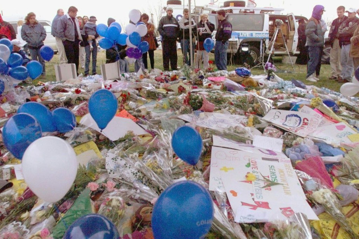 Littleton, Colorado residents mourn the 13 people killed by two heavily armed students at Columbine High School on April 20, 1999