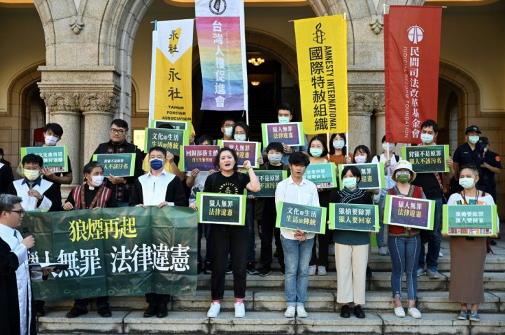 Protesters chanted slogans after a ruling on whether current hunting limitations placed on Taiwan's Indigenous communities are unconstitutional