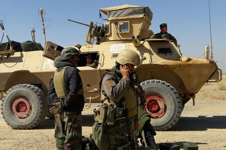 Afghan security forces during ongoing fighting with Taliban fighters on the outskirts of Lashkar Gah, the capital city of Helmand province