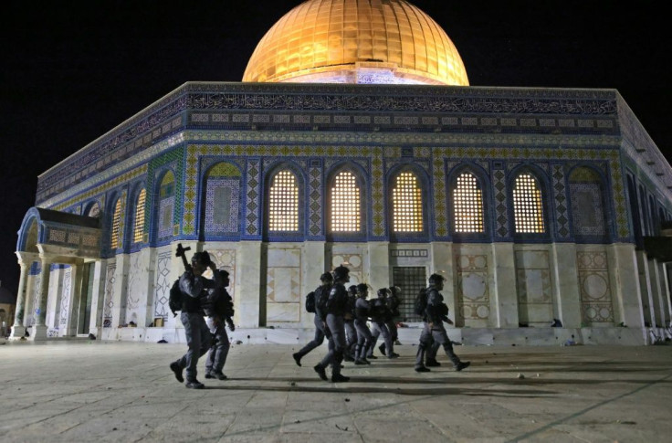 Israeli security forces deploy next to the Dome of the Rock mosque amid clashes with Palestinian protesters at the al-Aqsa mosque compound in Jerusalem