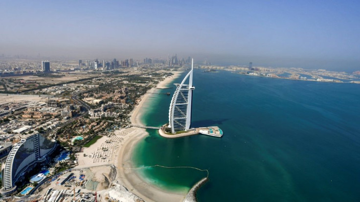 A view of the Burj al-Arab hotel in the Gulf emirate of Dubai, with the man-made Palm Jumeirah archipelago seen in the background