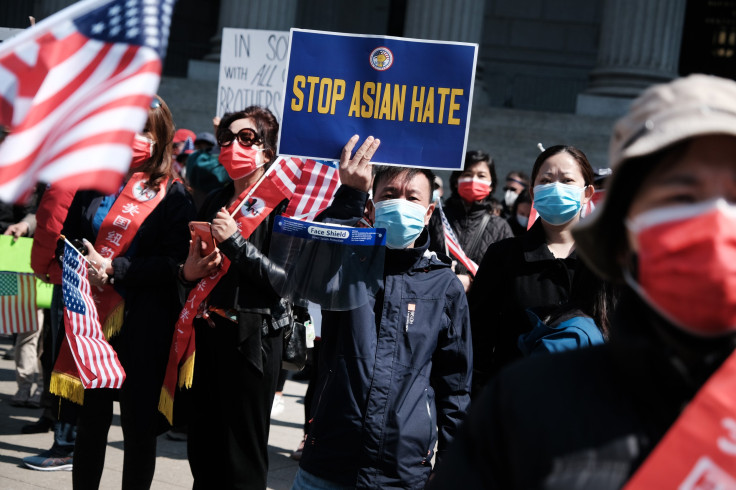 People participate in a protest to demand an end to anti-Asian violence 