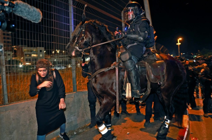 Israeli mounted policemen disperse protesters during a demonstration by Palestinians against the possible eviction of Palestinian families from their homes in Sheikh Jarrah