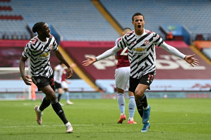 Manchester United forward Mason Greenwood (R) celebrates scoring at Aston Villa