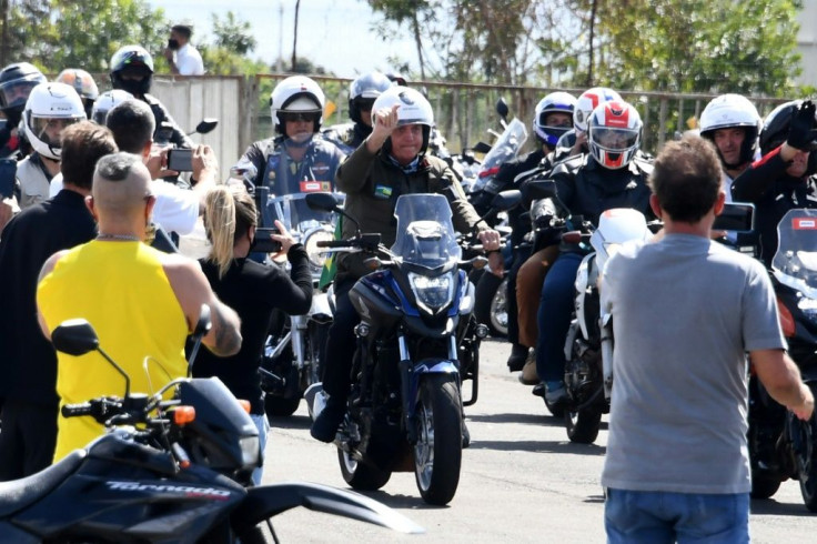 Brazil President Jair Bolsonaro (center) leads a motorcycle rally by supporters around the capital Brasilia to show support for the far right leader