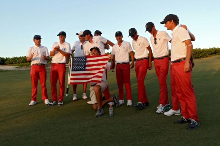 Members of Team USA pose for photos after defeating Team Great Britain & Ireland 14-12 in the 2021 Walker Cup amateur golf match