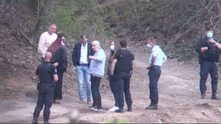 This video grab from AFP TV footage shows the French killer Michel Fourniret's ex-wife Monique Olivier (centre, grey sweatshirt) talking with investigators during the search for the remains of nine-year-old Estelle Mouzin