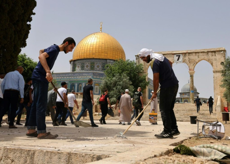 Palestinians clean Jerusalem's Al-Aqsa mosque compoundfollowing renewed clashes between Palestinians and Israeli police