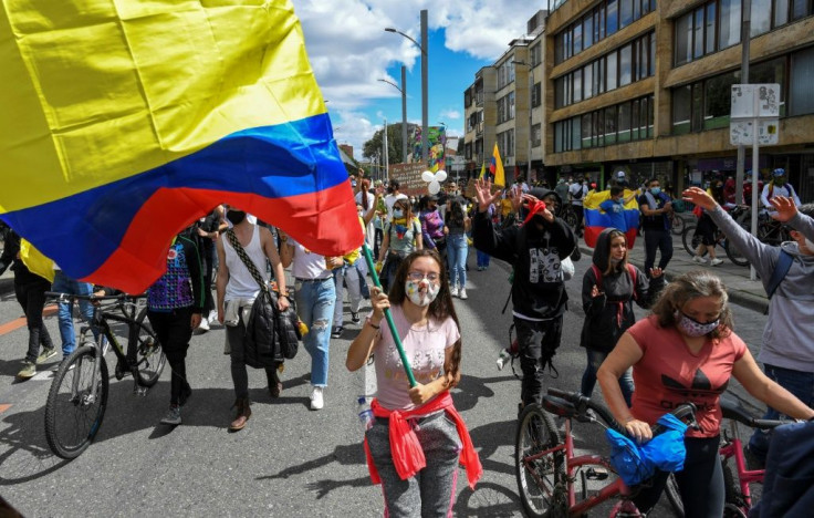 Anti-government protests in Colombia have continued despite authorities shelving a proposed tax reform