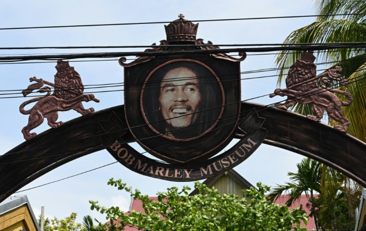 A sign showing Jamaican reggae legend Bob Marley at the entrance to the Bob Marley Museum in Kingston, Jamaica, on May 17, 2019
