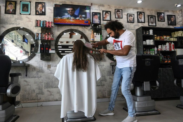 Abbas charges 2,000 rupees ($13) for the unorthodox treatment -- or 1,000 rupees for a traditional trim with scissors
