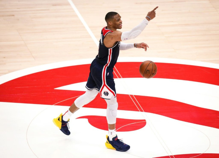 Historic: Russell Westbrook signals to his teammates on his way to breaking Oscar Robertson's triple-double record