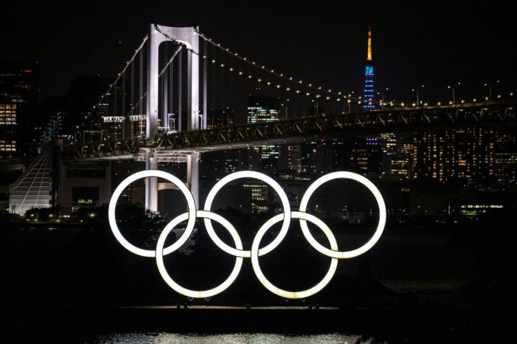 The Olympic rings light up the Odaiba waterfront in Tokyo