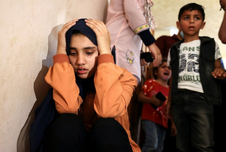 Relatives of Palestinian Hussein Hamad, 11, mourn during his funeral in Beit Hanun