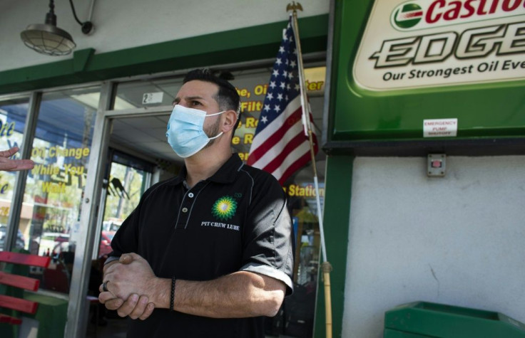 Jesse Georgaklis, owner of a BP gas station, worries about the potential job losses in the gasoline industry, even as he hopes green energy will provide a better future for his son's generationspeaks during an interview with AFP in Bridge, New Jersey on