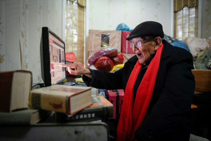 Gu Bin, a former accountant, mostly stays home after a fall a few years ago -- but he maintains his sharp wit and keeps connected with the outside world through the internet