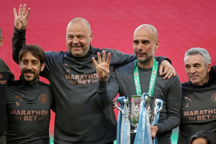 "This has been a season and a Premier League title like no other. This was the hardest one," says Pep Guardiola, seen here second from right, celebrating his side's League Cup win at Wembley just over two weeks ago