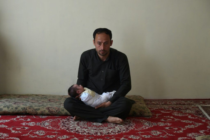 Akram Muradi with the newborn Maryam after last year's attack