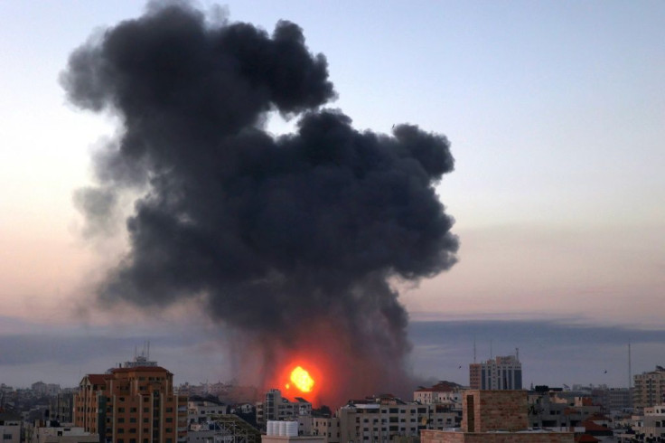 Smoke rises after an Israeli air strike in Gaza City early on May 12