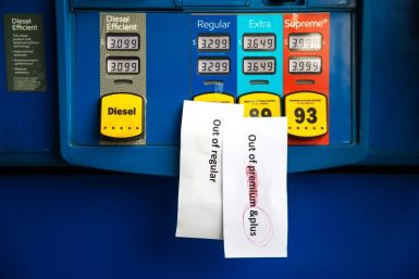 Notes are left on pumps to let motorists know they are empty at an Exxon gas station in Charlotte, North Carolina