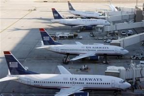 US Airways aircrafts sit outside terminal 4 at Phoenix Sky Harbor International Airport in Phoenix