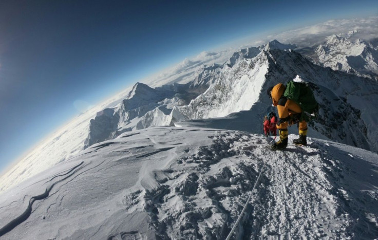 Mountaineers make their way to the summit of Mount Everest, as they ascend on the south face from Nepal on May 17, 2018