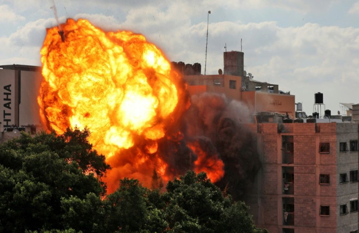 Fire engulfs a building after an Israeli airstrike on Gaza City Thursday