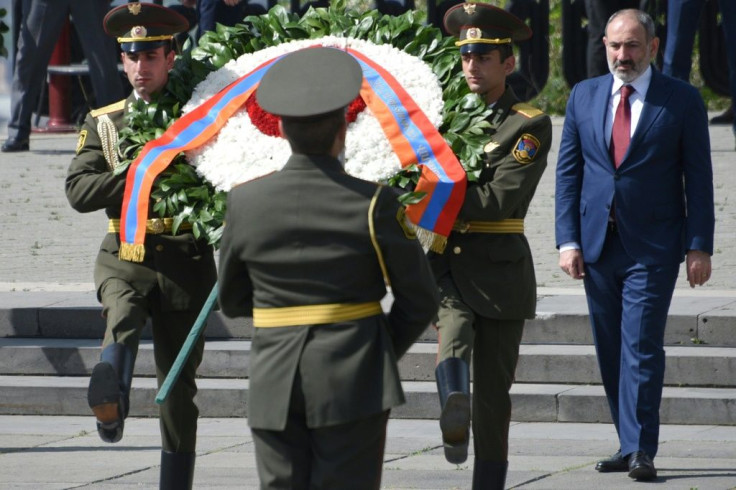 Armenian acting Prime Minister Nikol Pashinyan attends a wreath-laying ceremony celebrating the Allied victory against Nazi Germany on May 9, 2021