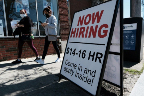 A company advertises a help wanted sign in Pawtucket, Rhode Island in April
