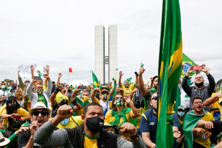 People take part in a demonstration to show their support for Brazilian President Jair Bolsonaro amid the COVID-19 novel coronavirus disease pandemic, in Brasilia, on May 1, 2021