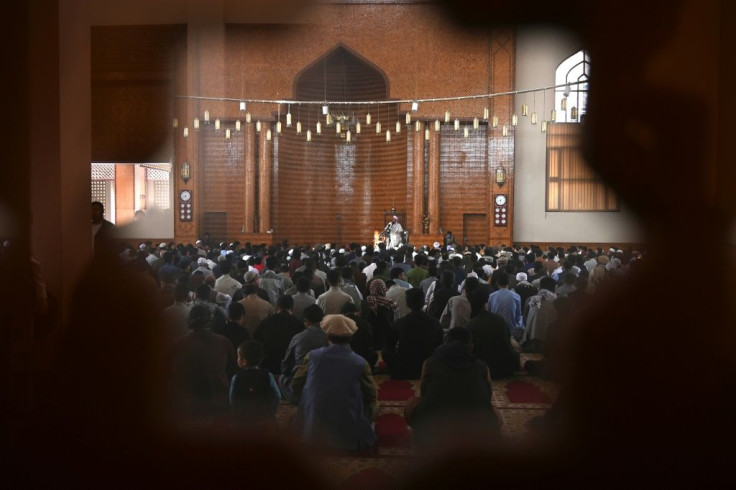 Muslim devotees offer prayers to start the Eid-al-Fitr festival at a mosque in Kabul