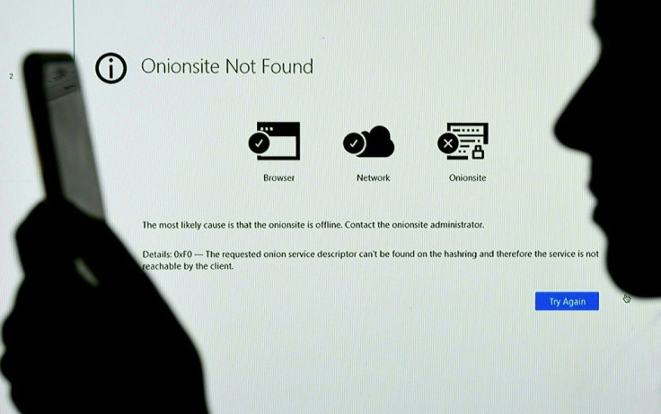 This photo illustration shows the Onionsite address for cyber-extortionist Darkside with a notice saying it could not be found