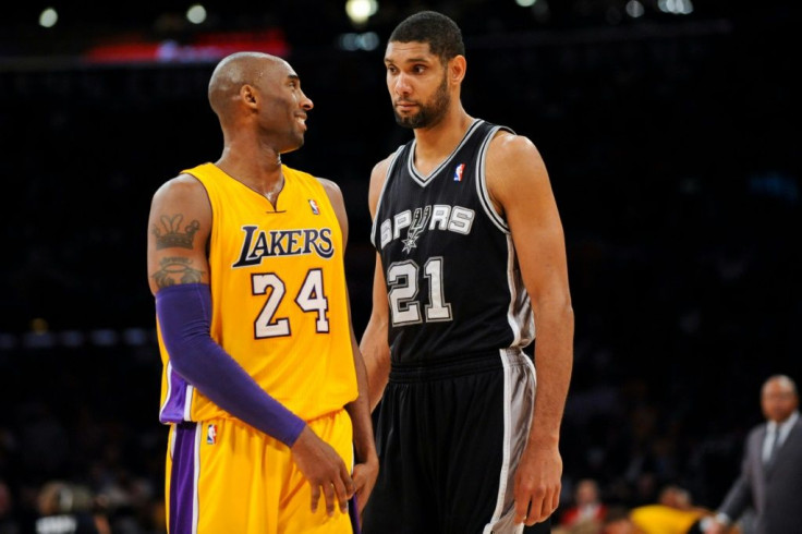 Tim Duncan of the San Antonio Spurs and Kobe Bryant of the Los Angeles Lakers share a laugh during a November 2012 NBA game. The two will be among those inducted as the class of 2020 -- Bryant posthumously after his death in a helicopter crash -- into the