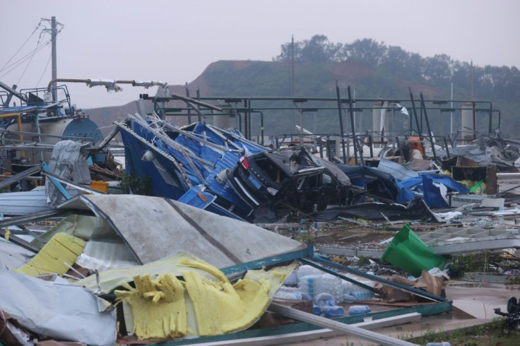 Vehicles were crushed by falling objects, trees uprooted, buildings partially destroyed and electrity pylons felled