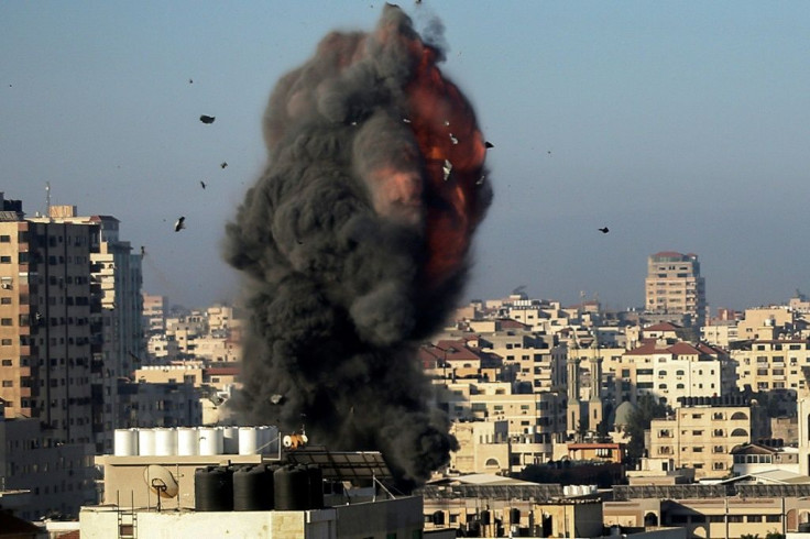 Smoke billows over the Hamas-linked Ansar compound in Gaza City, one of many symbols of the Islamist movement's authority in Gaza that Israel has targeted in its bombing campaign