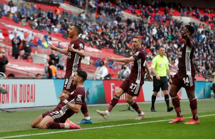 Leicester players and fans celebrate Youri Tielemans's (top left) winner against Chelsea in the FA Cup final