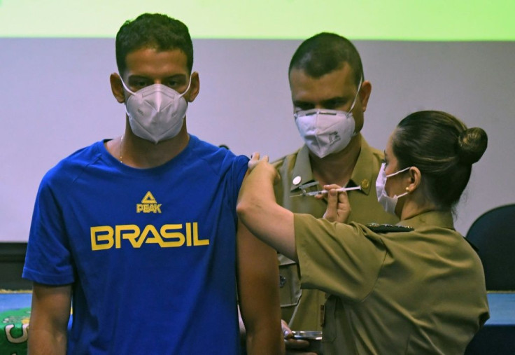 Brazilian bow and arrow athlete Marcus Vinicius D'Almeida is inoculated with a Covid-19 vaccine as part of a project organized by the Brazilian federal government to vaccinate Brazilian citizens accredited to the Tokyo Olympic Games amid the COVID-19 pand