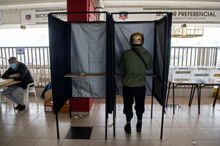 A person votes at a polling station in Santiago in Chile's elections on March 15, 2021