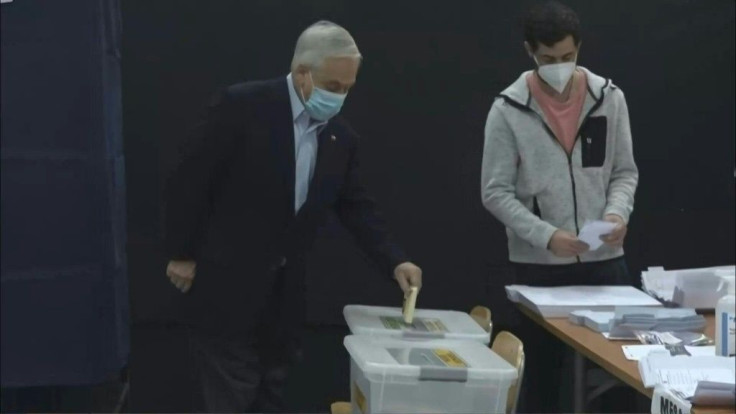 Chile's President Sebastian Pinera votes in an unprecedented election as the country is heading to the polls to decide who will write the new constitution