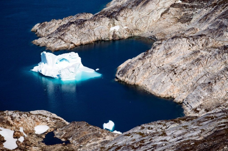 This aerial file photo taken on August 15, 2019 shows an iceberg floating off the eastern coast of Greenland, part of a vast and increasingly coveted Arctic region