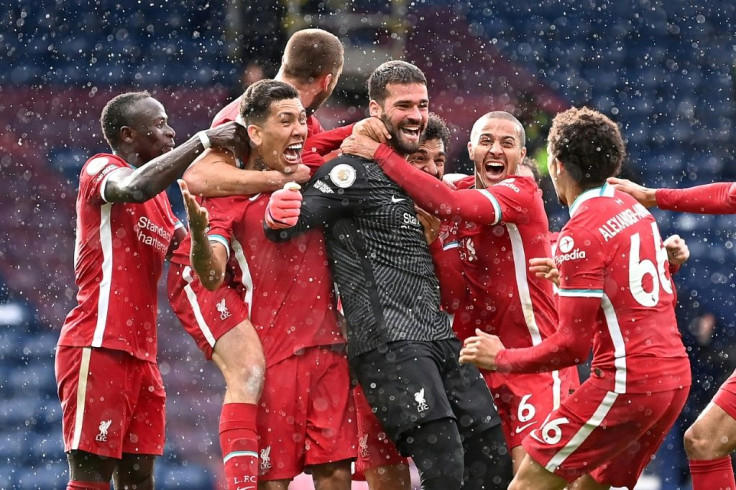 Alisson Becker celebrates scoring Liverpool's winning goal against West Bromwich Albion in stoppage time